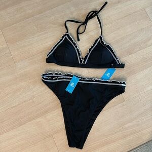 Black and white bikini, high cut/high waisted. Brand new with tags, never worn